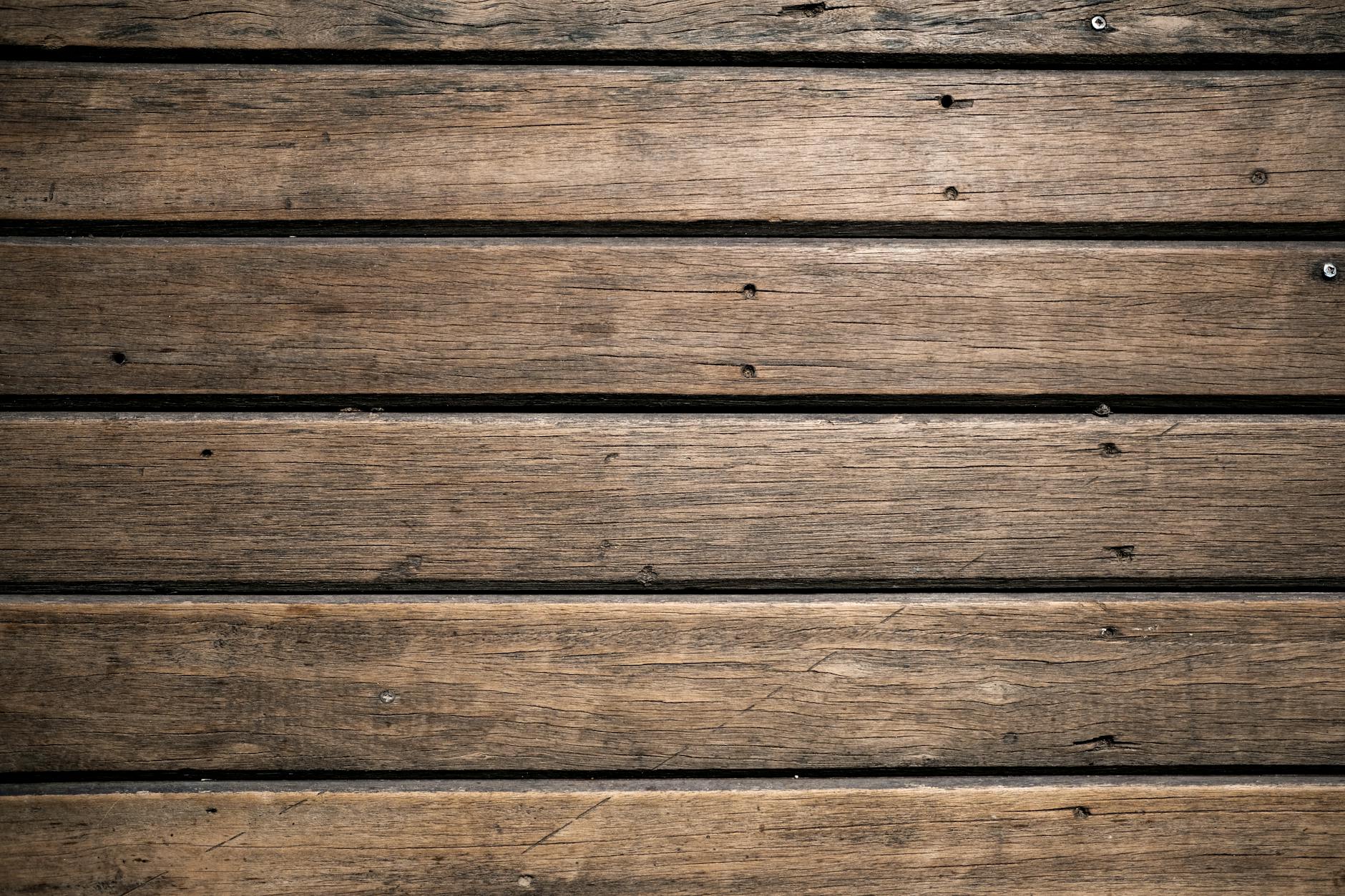 Close-up of aged wooden planks with rustic texture for background or design.