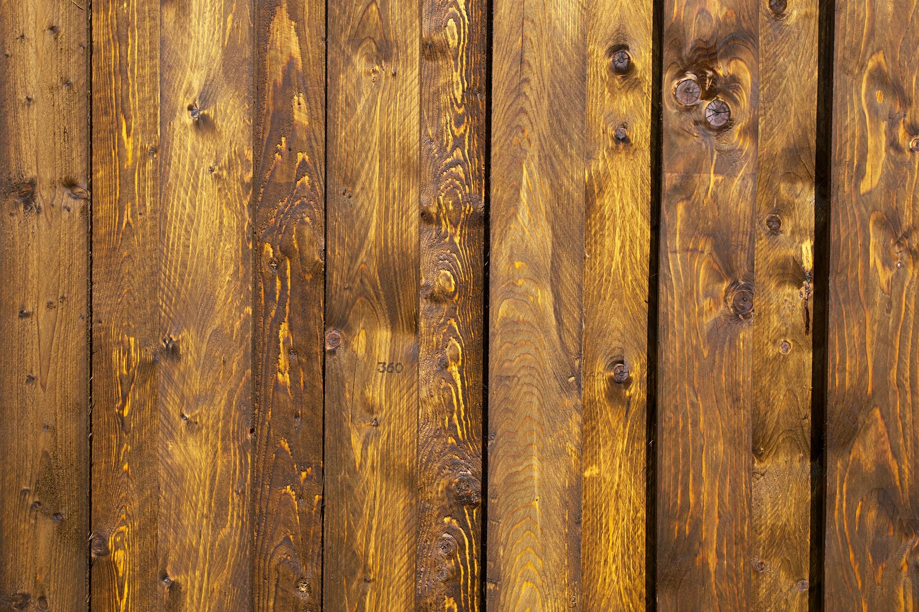 A detailed close-up of rustic wooden panels showcasing natural grain and texture.