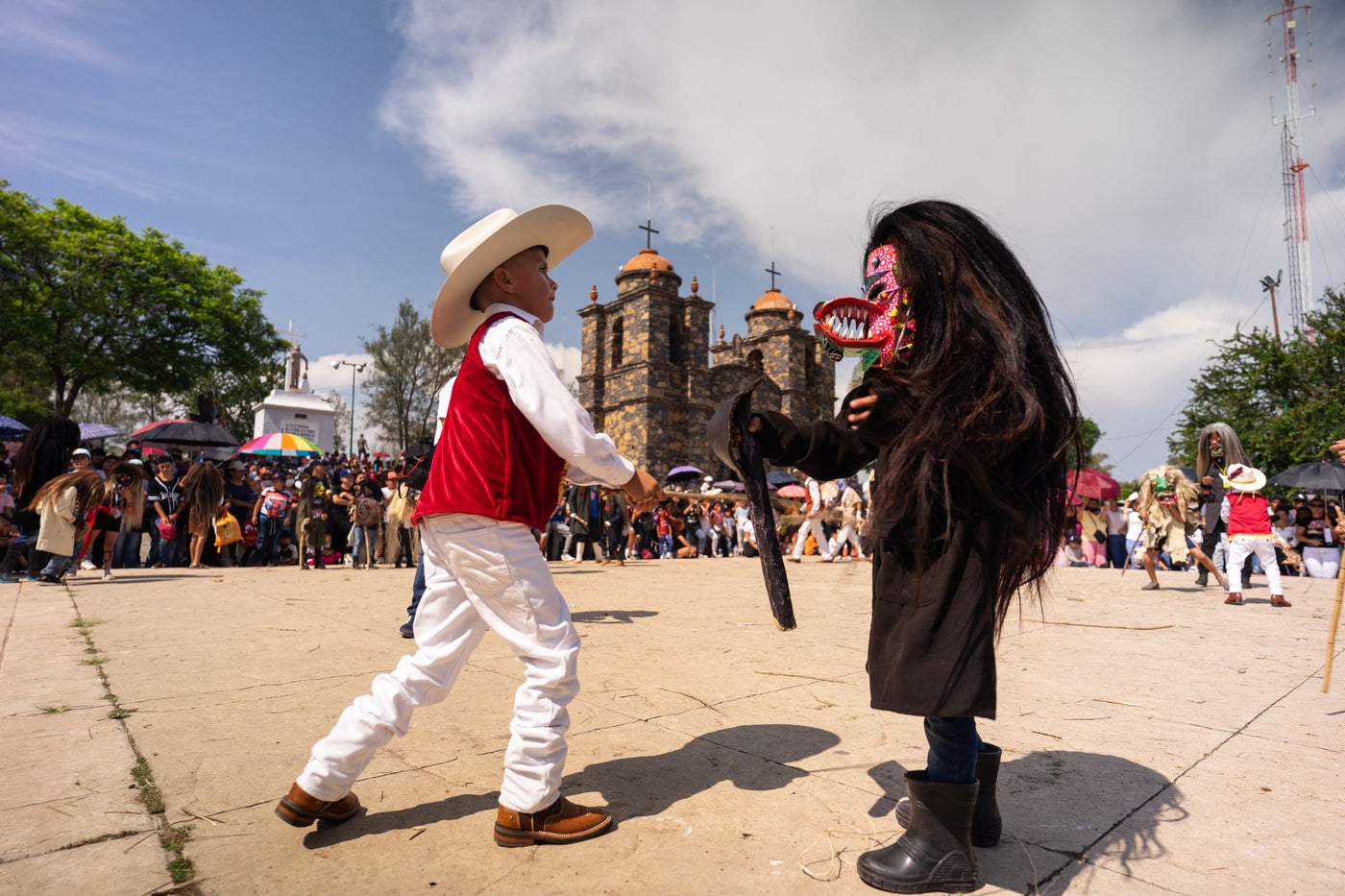 Colorful celebration featuring traditional costumes and lively dance at a Mexican festival.