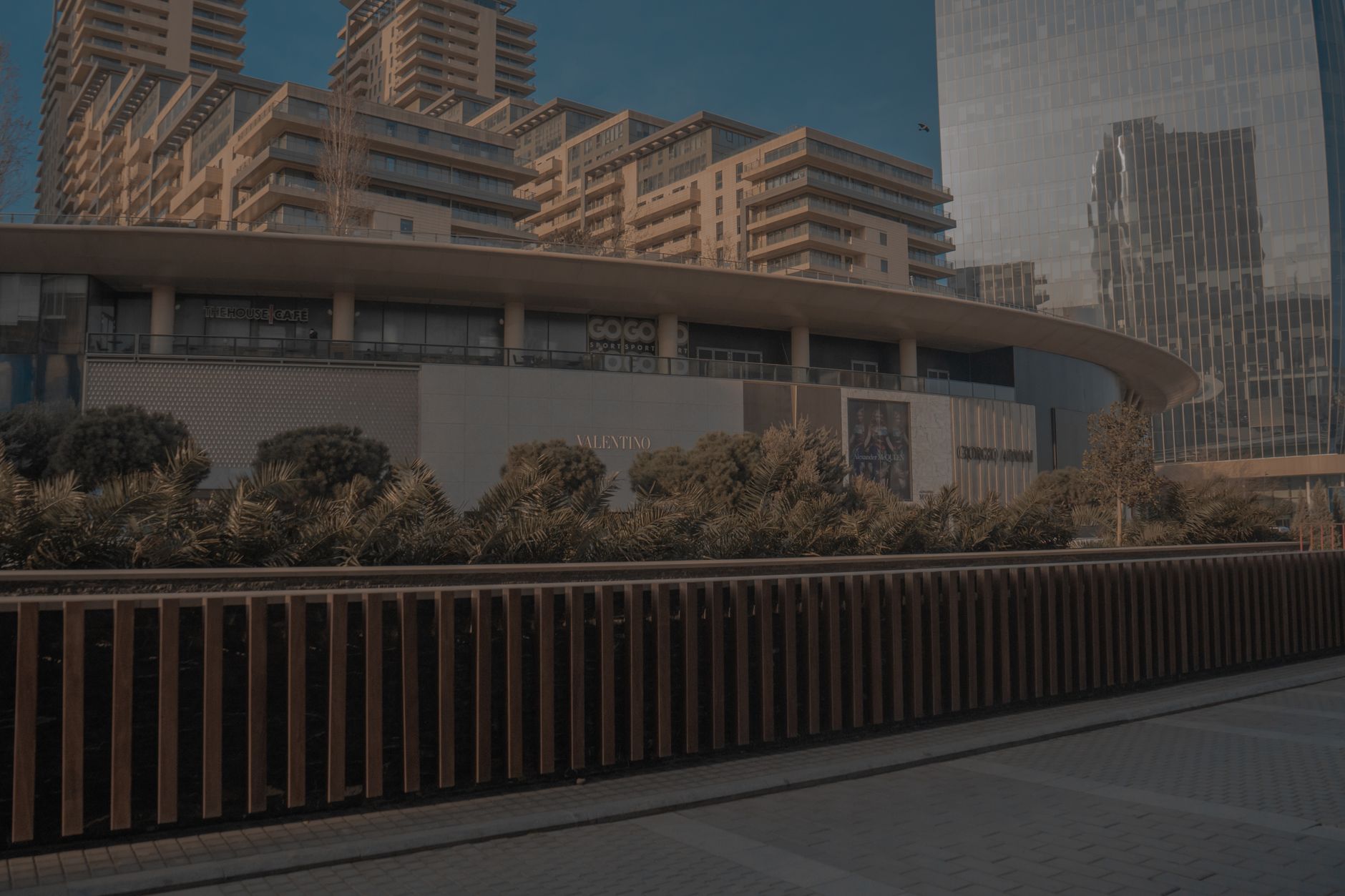 Contemporary skyscrapers and shopping mall facade in Baku, showcasing urban modern architecture.