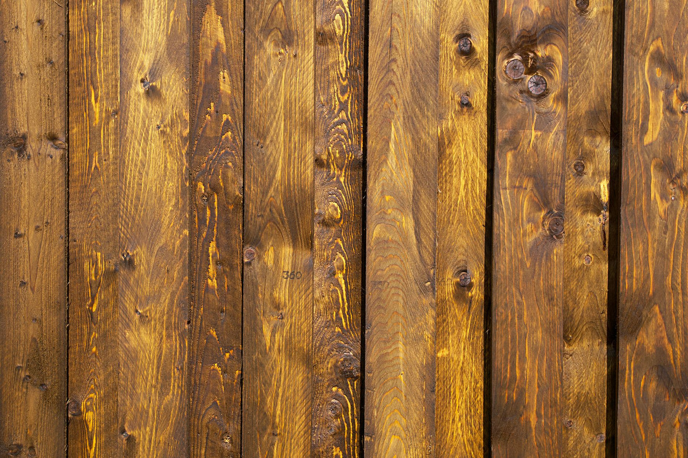 A detailed close-up of rustic wooden panels showcasing natural grain and texture.