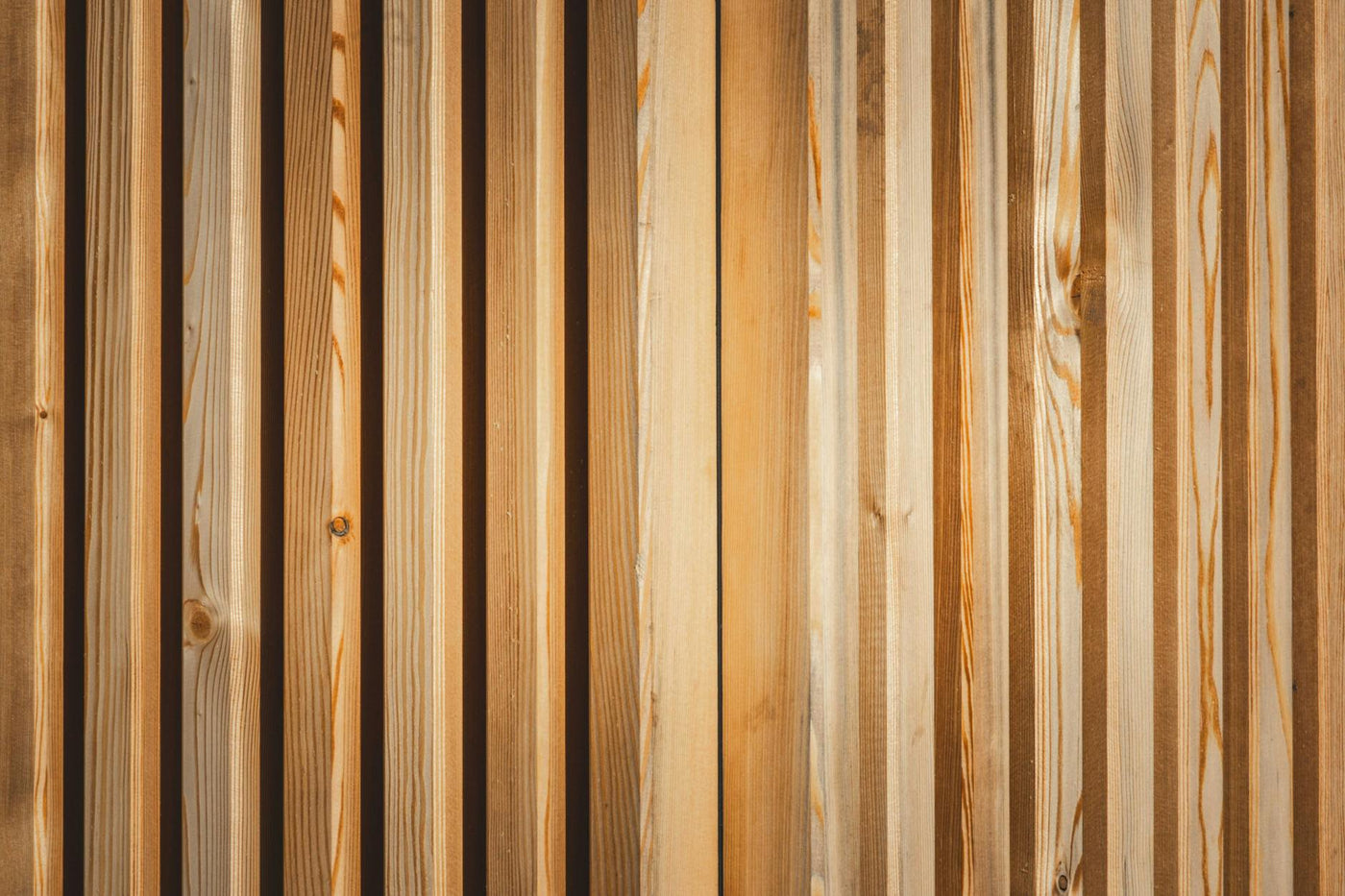 A detailed view of a wooden panel with natural texture and pattern, showcasing the beauty of wood grain.