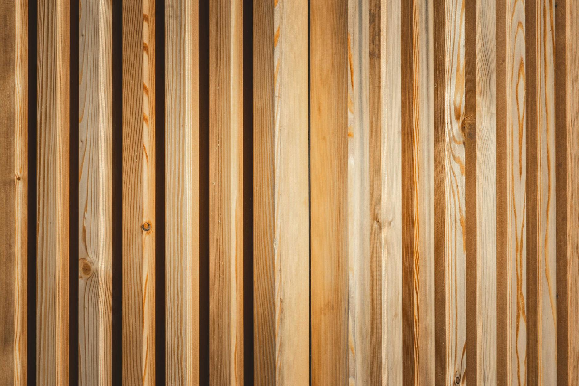 A detailed view of a wooden panel with natural texture and pattern, showcasing the beauty of wood grain.
