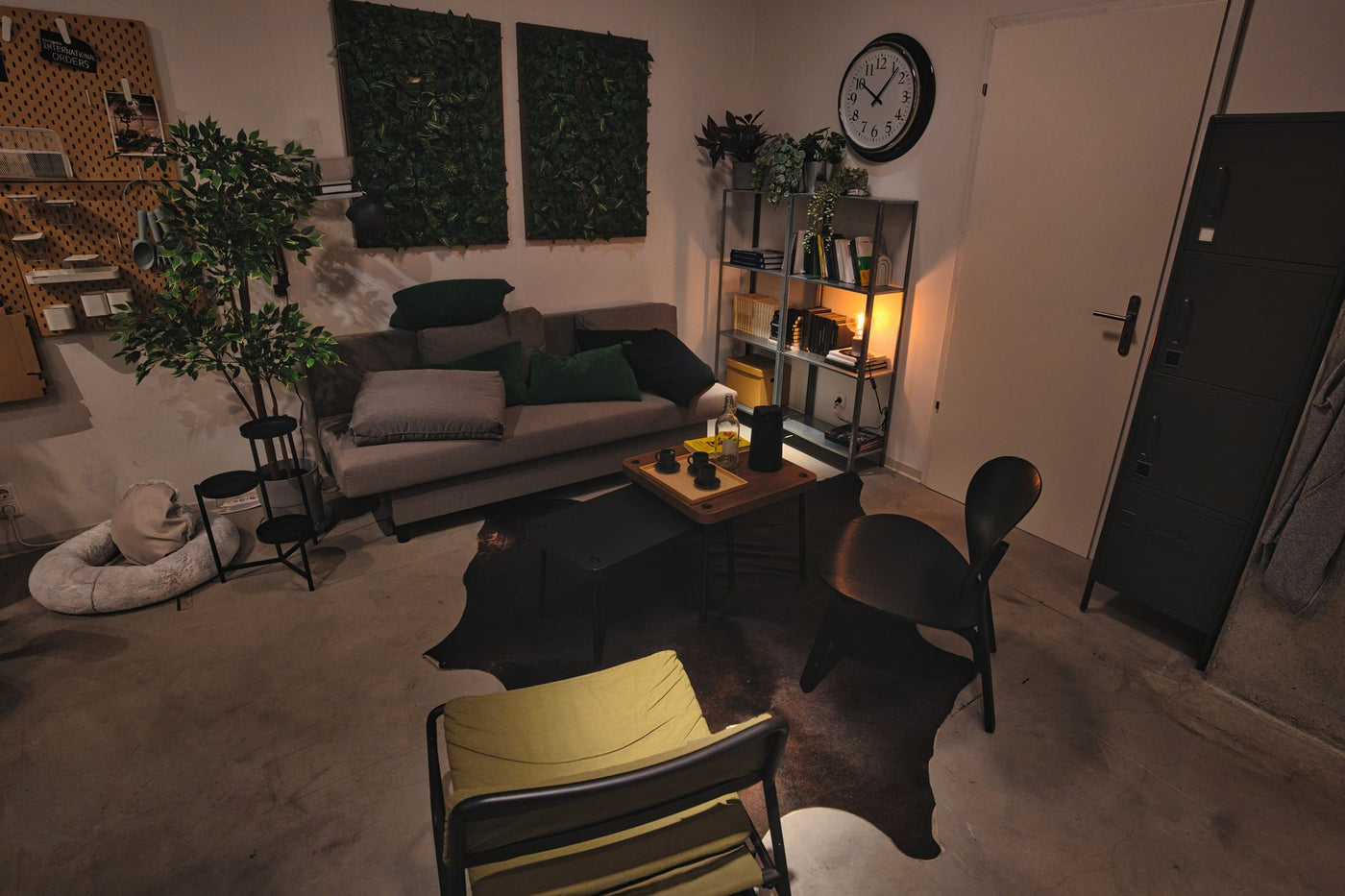 A stylish modern living room with cozy seating and ambient lighting for a relaxing atmosphere.